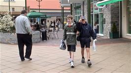 Joe and James return to the group after the shopping expedition at Clarks Village, Street